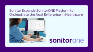 SonitorONE expands platform to healthcare. A person in scrubs works on a computer.