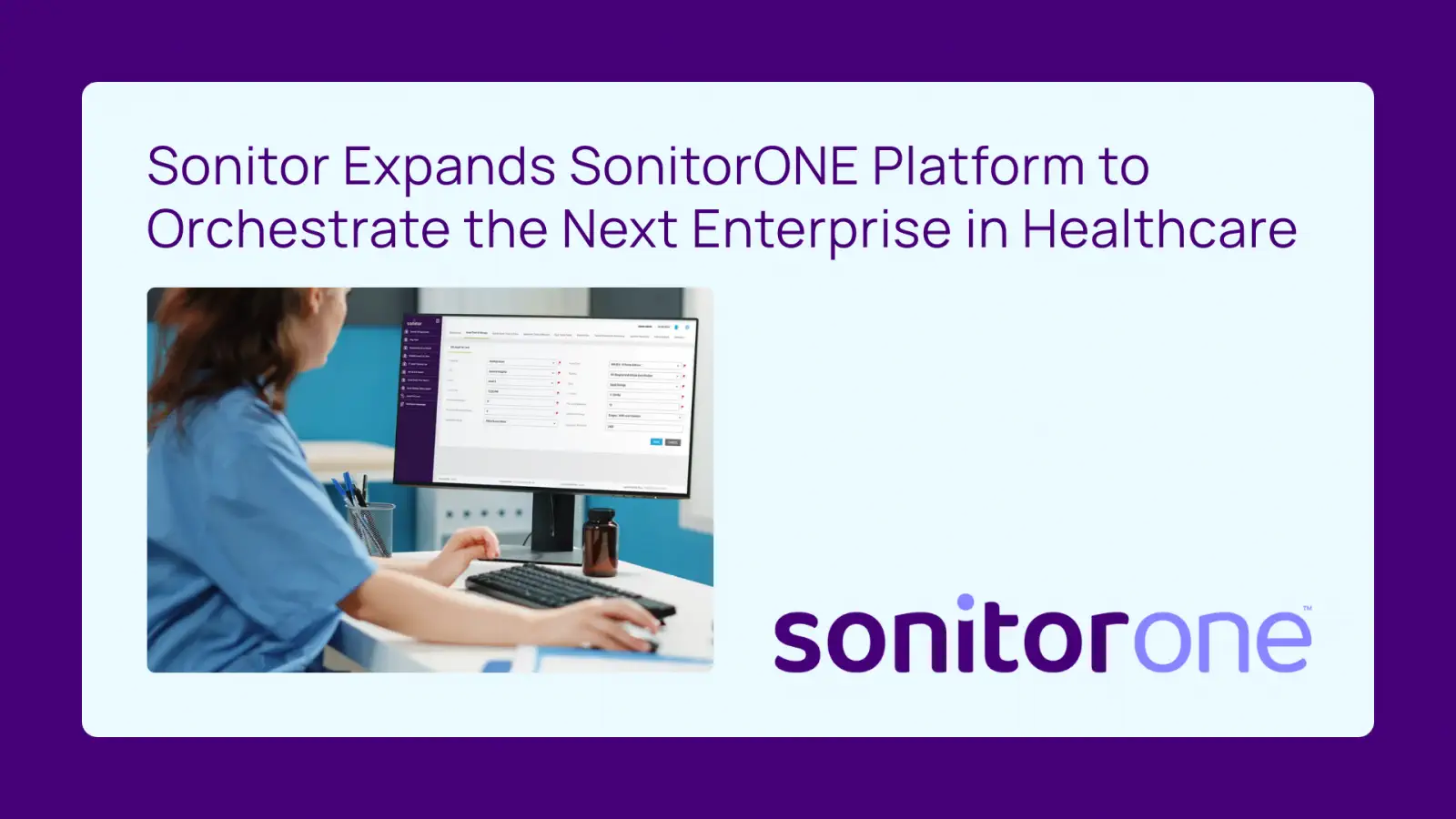 SonitorONE expands platform to healthcare. A person in scrubs works on a computer.